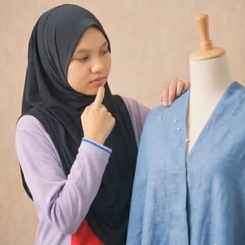 Nurul Syafiqah bt Nozie considering a chambray shirt on a dress form